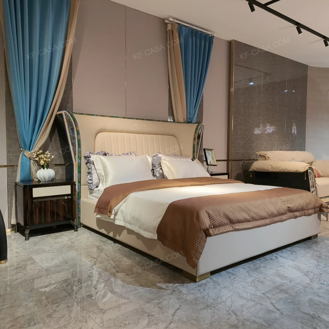 Cream Upholstered Bed with Decorative Accent Trim, Brand Emblem & Gold Stainless Steel Feet